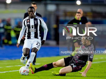 Timothy Weah of Juventus FC and Ardian Ismajli of Empoli FC compete for the ball during the Serie A Enilive match between Empoli FC and Juve...