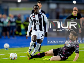 Timothy Weah of Juventus FC and Ardian Ismajli of Empoli FC compete for the ball during the Serie A Enilive match between Empoli FC and Juve...