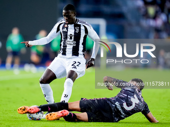 Timothy Weah of Juventus FC and Giuseppe Pezzella of Empoli FC compete for the ball during the Serie A Enilive match between Empoli FC and J...