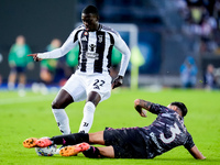 Timothy Weah of Juventus FC and Giuseppe Pezzella of Empoli FC compete for the ball during the Serie A Enilive match between Empoli FC and J...