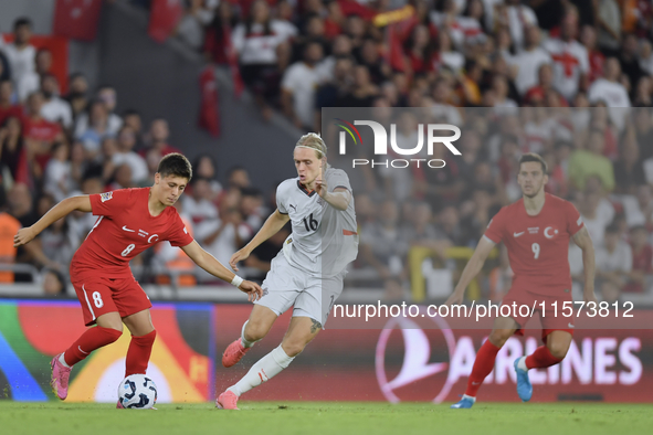 Arda Guler of Turkey and Stefan Teitur Thordarson of Iceland   during the UEFA Nations League 2024/25 League B Group B4 match between Turkiy...