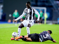 Timothy Weah of Juventus FC and Giuseppe Pezzella of Empoli FC compete for the ball during the Serie A Enilive match between Empoli FC and J...