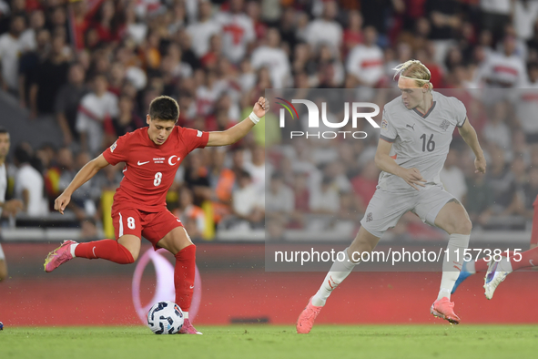 Arda Guler of Turkey and Stefan Teitur Thordarson of Iceland   during the UEFA Nations League 2024/25 League B Group B4 match between Turkiy...