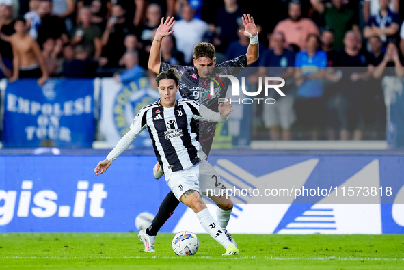 Nicolo' Fagioli of Juventus FC and Sebastiano Esposito of Empoli FC compete for the ball during the Serie A Enilive match between Empoli FC...