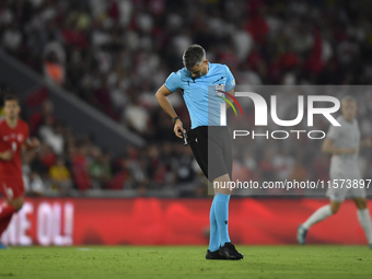 Referee Enea Jorgji in action  during the UEFA Nations League 2024/25 League B Group B4 match between Turkiye and Iceland at Gursel Aksel St...