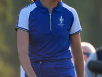 GAINESVILLE, VIRGINIA - SEPTEMBER 14: Georgia Hall of Team Europe walks on the third green during Day Two of the Solheim Cup at Robert Trent...