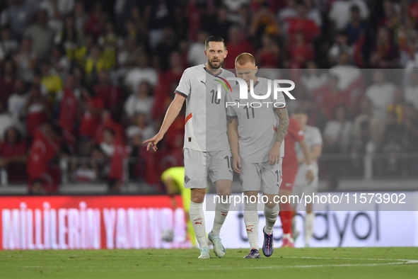 Gylfi Sigurdsson and Jon Dagur Thorsteinsson of Iceland   during the UEFA Nations League 2024/25 League B Group B4 match between Turkiye and...