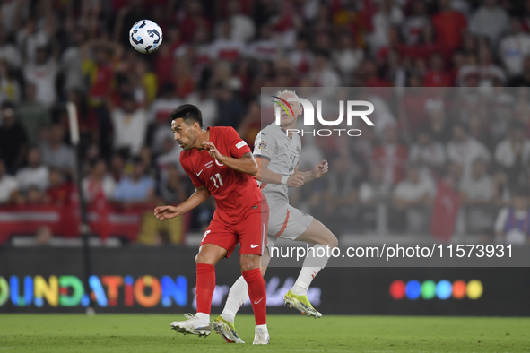 Irfan Can Kahveci of Turkey and Kolbeinn Finnsson of Iceland  during the UEFA Nations League 2024/25 League B Group B4 match between Turkiye...