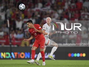 Irfan Can Kahveci of Turkey and Kolbeinn Finnsson of Iceland  during the UEFA Nations League 2024/25 League B Group B4 match between Turkiye...