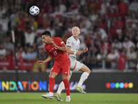 Irfan Can Kahveci of Turkey and Kolbeinn Finnsson of Iceland  during the UEFA Nations League 2024/25 League B Group B4 match between Turkiye...