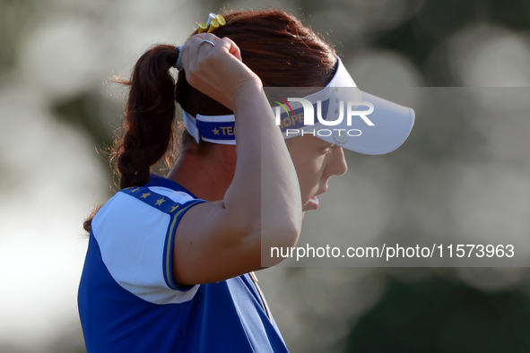 GAINESVILLE, VIRGINIA - SEPTEMBER 14: Georgia Hall of Team Europe walks on the third green during Day Two of the Solheim Cup at Robert Trent...