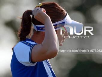 GAINESVILLE, VIRGINIA - SEPTEMBER 14: Georgia Hall of Team Europe walks on the third green during Day Two of the Solheim Cup at Robert Trent...