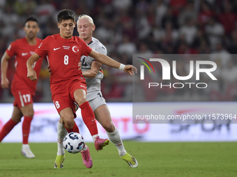 Arda Guler of Turkey and Kolbeinn Finnsson of Iceland  during the UEFA Nations League 2024/25 League B Group B4 match between Turkiye and Ic...