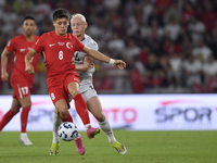 Arda Guler of Turkey and Kolbeinn Finnsson of Iceland  during the UEFA Nations League 2024/25 League B Group B4 match between Turkiye and Ic...