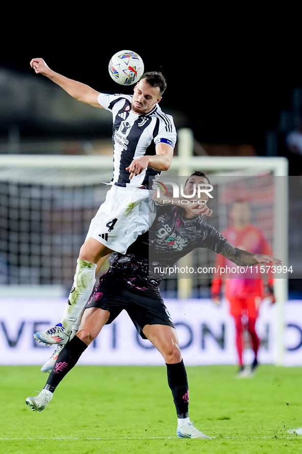 Pietro Pellegri of Empoli FC and Federico Gatti of Juventus FC jump for the ball during the Serie A Enilive match between Empoli FC and Juve...