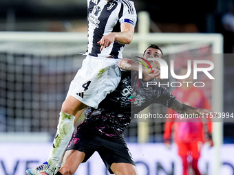 Pietro Pellegri of Empoli FC and Federico Gatti of Juventus FC jump for the ball during the Serie A Enilive match between Empoli FC and Juve...