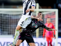 Pietro Pellegri of Empoli FC and Federico Gatti of Juventus FC jump for the ball during the Serie A Enilive match between Empoli FC and Juve...