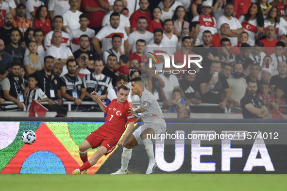 Kerem Akturkoglu of Turkey and Victor Palsson of Iceland  during the UEFA Nations League 2024/25 League B Group B4 match between Turkiye and...