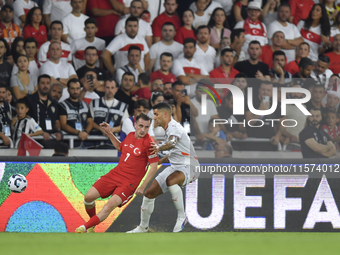 Kerem Akturkoglu of Turkey and Victor Palsson of Iceland  during the UEFA Nations League 2024/25 League B Group B4 match between Turkiye and...