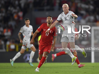 Irfan Can Kahveci of Turkey and Kolbeinn Finnsson of Iceland  during the UEFA Nations League 2024/25 League B Group B4 match between Turkiye...