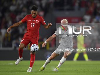 Irfan Can Kahveci of Turkey and Kolbeinn Finnsson of Iceland  during the UEFA Nations League 2024/25 League B Group B4 match between Turkiye...