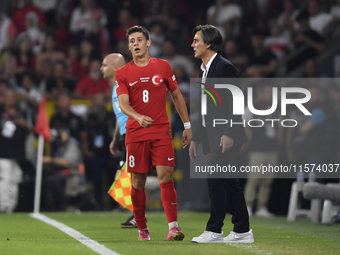 Arda Guler of Turkey and Turkey head coach Vincenzo Montella   during the UEFA Nations League 2024/25 League B Group B4 match between Turkiy...