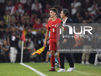 Arda Guler of Turkey and Turkey head coach Vincenzo Montella   during the UEFA Nations League 2024/25 League B Group B4 match between Turkiy...