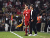 Arda Guler of Turkey and Turkey head coach Vincenzo Montella   during the UEFA Nations League 2024/25 League B Group B4 match between Turkiy...