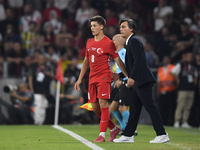 Arda Guler of Turkey and Turkey head coach Vincenzo Montella   during the UEFA Nations League 2024/25 League B Group B4 match between Turkiy...