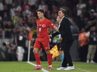 Arda Guler of Turkey and Turkey head coach Vincenzo Montella   during the UEFA Nations League 2024/25 League B Group B4 match between Turkiy...