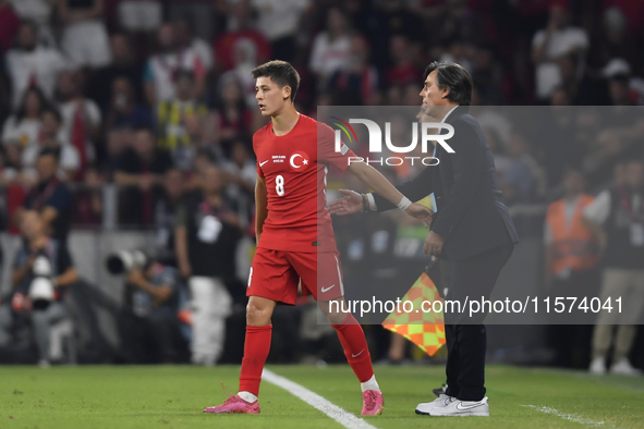 Arda Guler of Turkey and Turkey head coach Vincenzo Montella   during the UEFA Nations League 2024/25 League B Group B4 match between Turkiy...