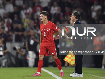 Arda Guler of Turkey and Turkey head coach Vincenzo Montella   during the UEFA Nations League 2024/25 League B Group B4 match between Turkiy...