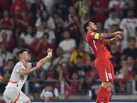 Hakan Calhanoglu of Turkey and Johann Gudmundsson of Iceland   during the UEFA Nations League 2024/25 League B Group B4 match between Turkiy...