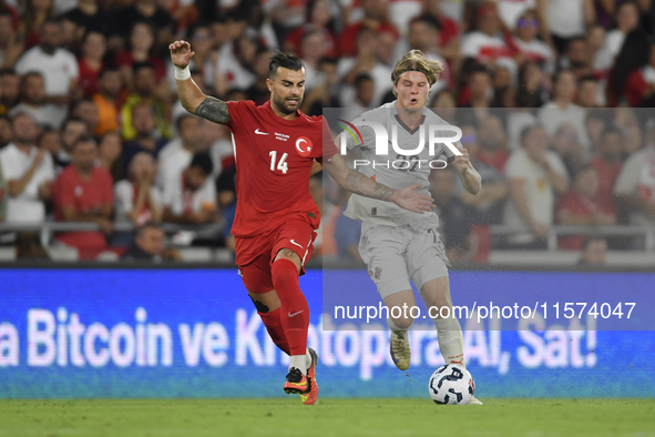 Abdulkerim Bardakci of Turkey and Andri Gudjohnsen of Iceland  during the UEFA Nations League 2024/25 League B Group B4 match between Turkiy...