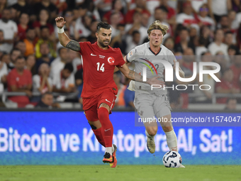 Abdulkerim Bardakci of Turkey and Andri Gudjohnsen of Iceland  during the UEFA Nations League 2024/25 League B Group B4 match between Turkiy...