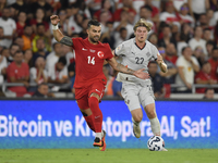 Abdulkerim Bardakci of Turkey and Andri Gudjohnsen of Iceland  during the UEFA Nations League 2024/25 League B Group B4 match between Turkiy...