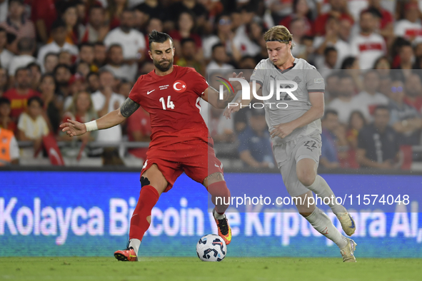 Abdulkerim Bardakci of Turkey and Andri Gudjohnsen of Iceland  during the UEFA Nations League 2024/25 League B Group B4 match between Turkiy...