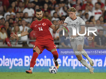 Abdulkerim Bardakci of Turkey and Andri Gudjohnsen of Iceland  during the UEFA Nations League 2024/25 League B Group B4 match between Turkiy...