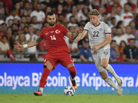 Abdulkerim Bardakci of Turkey and Andri Gudjohnsen of Iceland  during the UEFA Nations League 2024/25 League B Group B4 match between Turkiy...