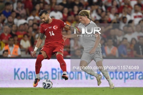 Abdulkerim Bardakci of Turkey and Andri Gudjohnsen of Iceland  during the UEFA Nations League 2024/25 League B Group B4 match between Turkiy...