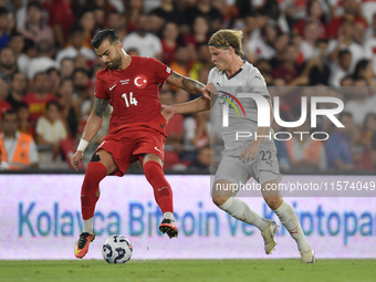 Abdulkerim Bardakci of Turkey and Andri Gudjohnsen of Iceland  during the UEFA Nations League 2024/25 League B Group B4 match between Turkiy...