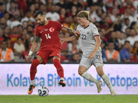 Abdulkerim Bardakci of Turkey and Andri Gudjohnsen of Iceland  during the UEFA Nations League 2024/25 League B Group B4 match between Turkiy...