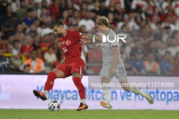 Abdulkerim Bardakci of Turkey and Andri Gudjohnsen of Iceland  during the UEFA Nations League 2024/25 League B Group B4 match between Turkiy...