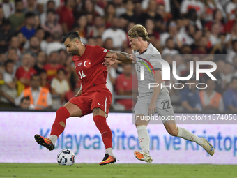 Abdulkerim Bardakci of Turkey and Andri Gudjohnsen of Iceland  during the UEFA Nations League 2024/25 League B Group B4 match between Turkiy...