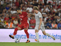 Abdulkerim Bardakci of Turkey and Andri Gudjohnsen of Iceland  during the UEFA Nations League 2024/25 League B Group B4 match between Turkiy...