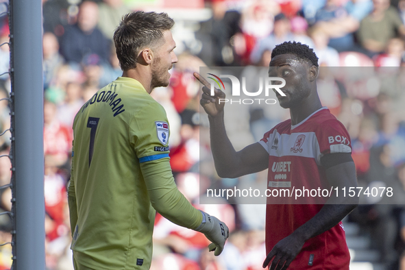 Emmanuel Latte Lath of Middlesbrough clashes with Preston North End goalkeeper Freddie Woodman during the Sky Bet Championship match between...