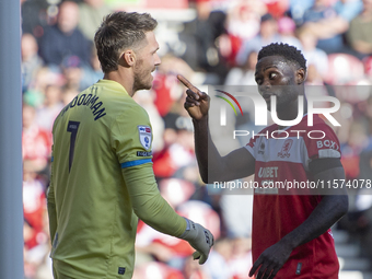 Emmanuel Latte Lath of Middlesbrough clashes with Preston North End goalkeeper Freddie Woodman during the Sky Bet Championship match between...