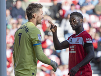 Emmanuel Latte Lath of Middlesbrough clashes with Preston North End goalkeeper Freddie Woodman during the Sky Bet Championship match between...