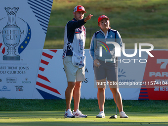 GAINESVILLE, VIRGINIA - SEPTEMBER 14: Allisen Corpuz of the United States looks from the 7th tee with her caddie during Day Two of the Solhe...