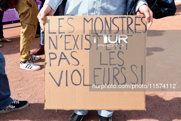 Several women and men gather with placards to support Gisele Pelicot and all rape victims in Lyon, France, on September 14, 2024. 